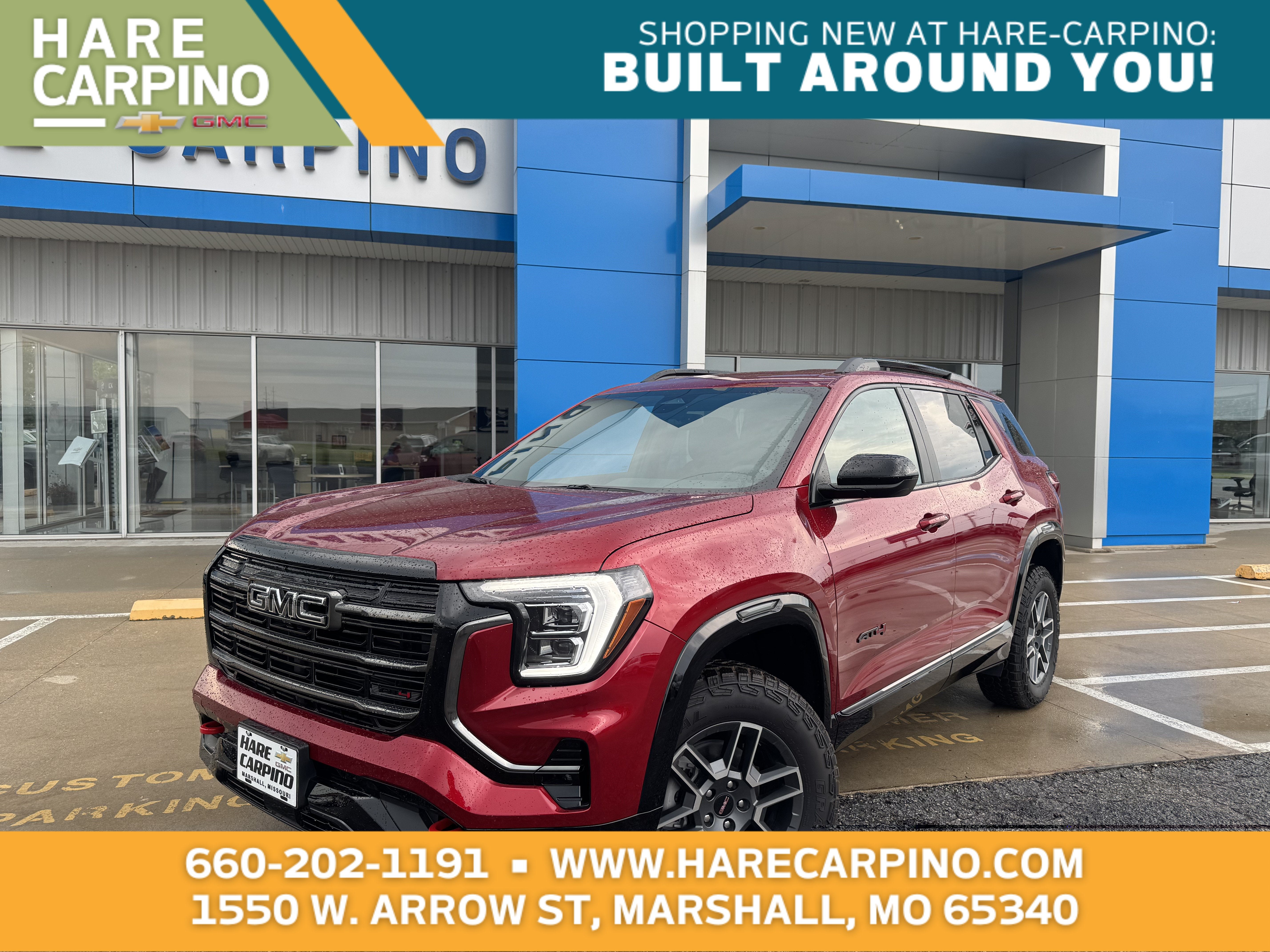 2026 GMC Terrain AT4 in Volcanic Red Tintcoat — front three-quarter view